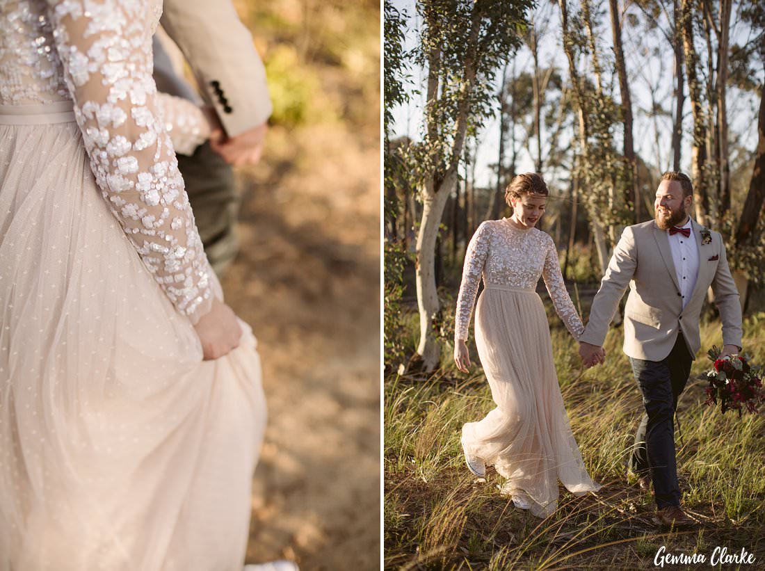 Walking among the bush fire regrowth at their Buxton wedding photo session hand in hand.