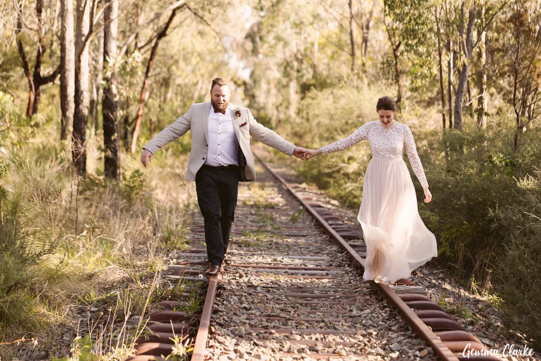 The balancing trick on these old unused train tracks at their Buxton Wedding - hand in hand!